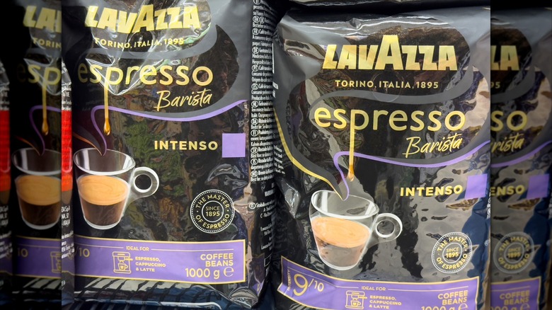 Close-up of two black bags of Lavazza espresso beans