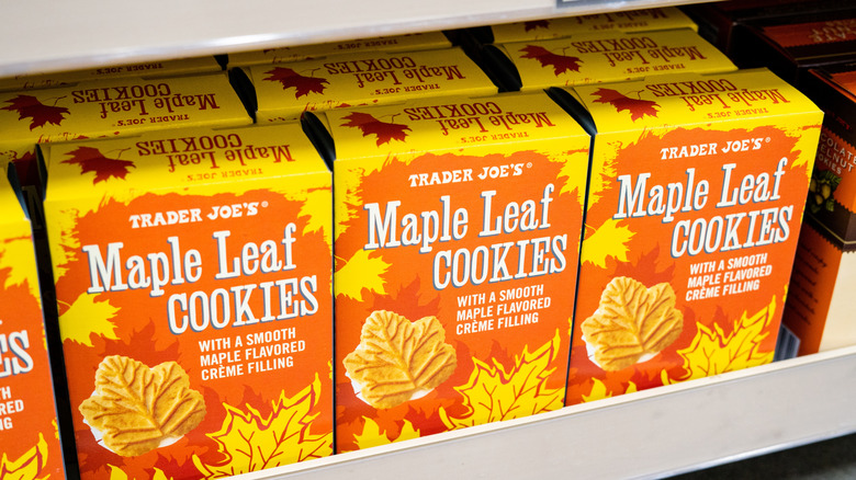 Several boxes of Trader Joe's Maple Leaf Cookies on a store shelf