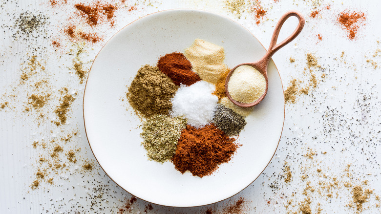 Different types of spices for taco seasoning on a plate
