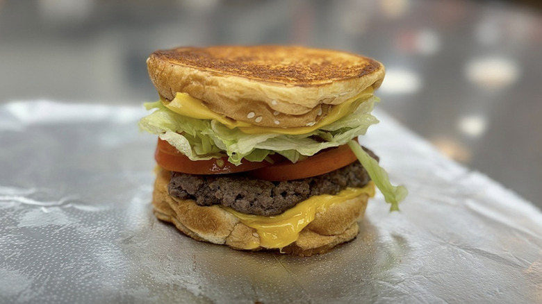 a Five Guys grilled cheese sandwich with an added burger and toppings