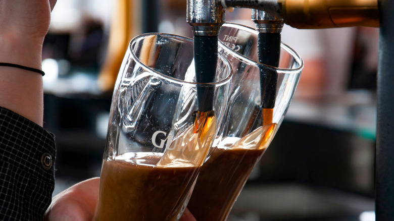 bartender pouring Guinness