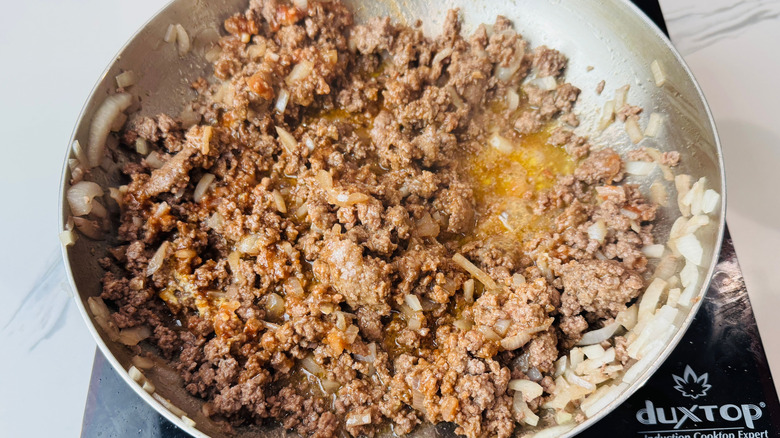 Beef and onion mixture in skillet