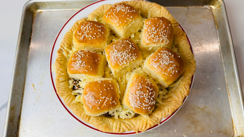 Cheeseburger pie topped with sesame slider buns