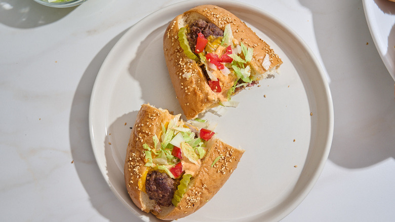 halved meatball sub on a plate
