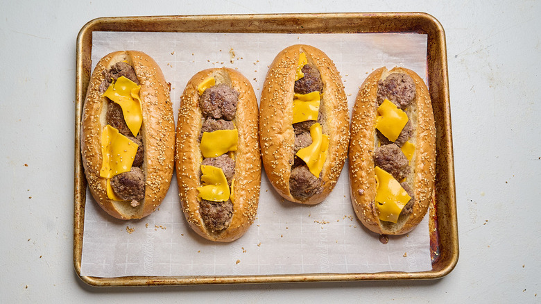 sandwiches filled with cheese and meatballs