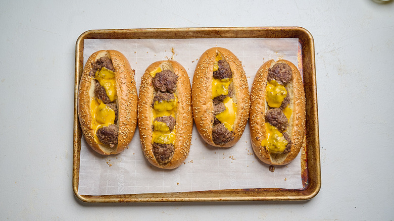 meatball subs covered in melted cheese