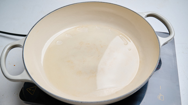 heating oil in a skillet