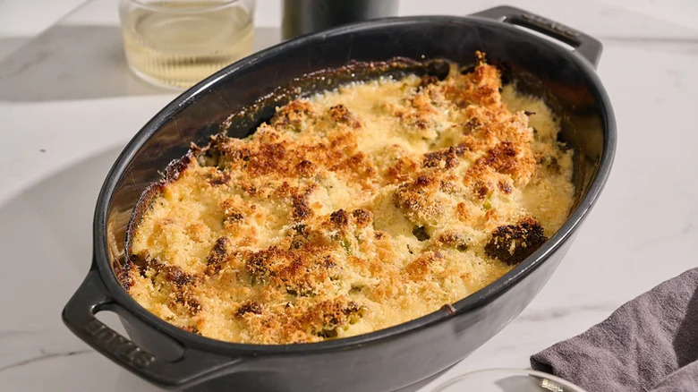 Casserole dish with broccoli au gratin on a countertop
