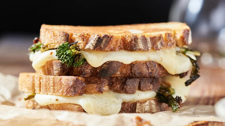 Close-up of two roasted broccoli rabe grilled cheese sandwiches