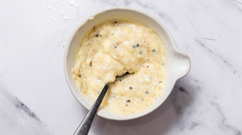 Compound butter with spoon in small bowl