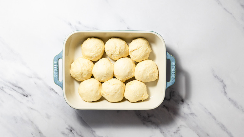 Balls of dough in baking dish