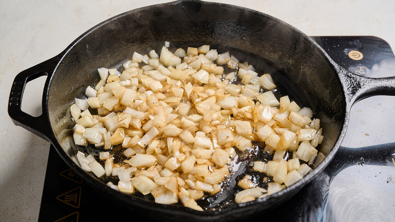 cooking onions in a skillet