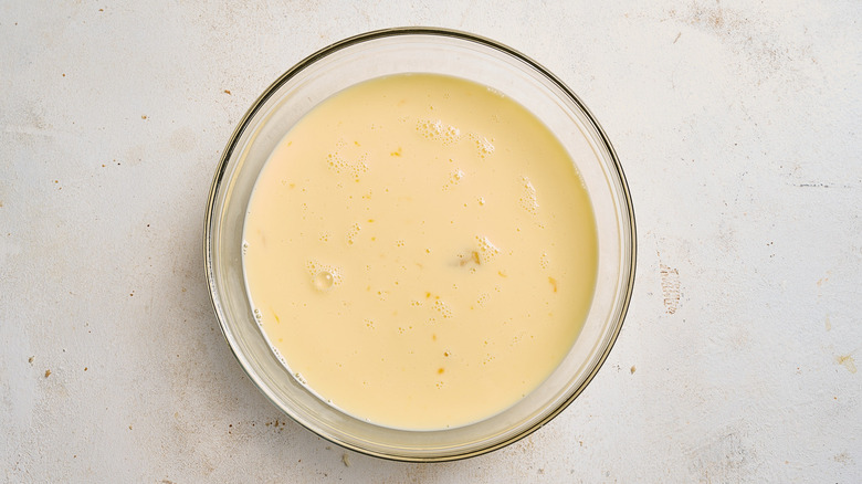 egg and milk whisked together in a bowl