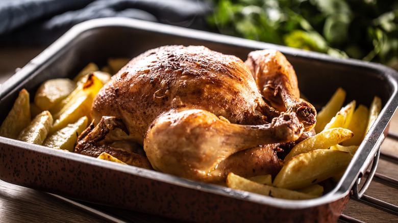 A roasted chicken in a pan