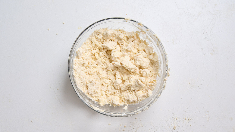 sour cream added to dry ingredients to form clumpy dough