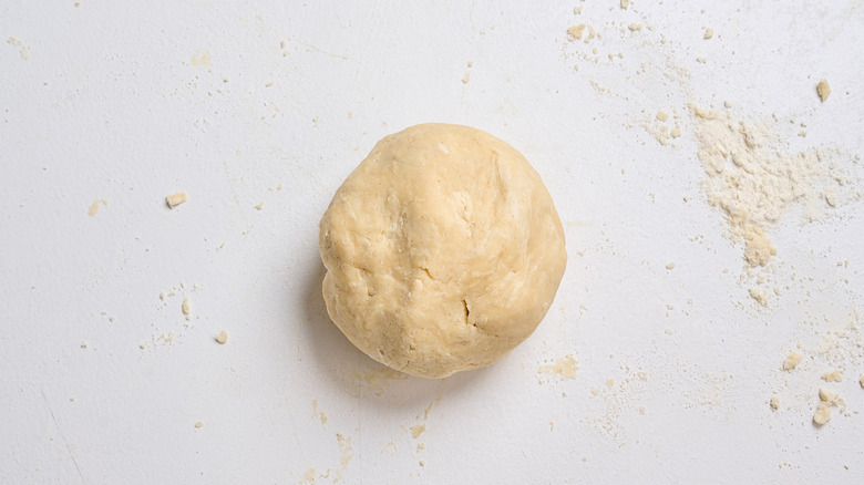dough kneaded into ball on a table