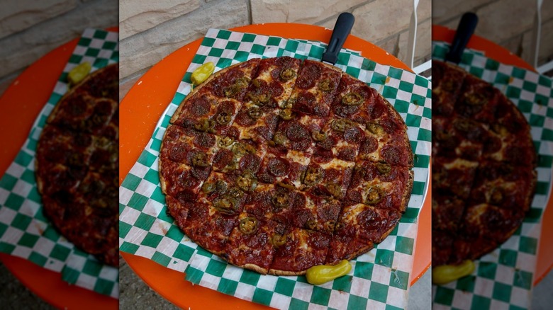 A thin-crust pizza with pepperoni at Novel Pizza