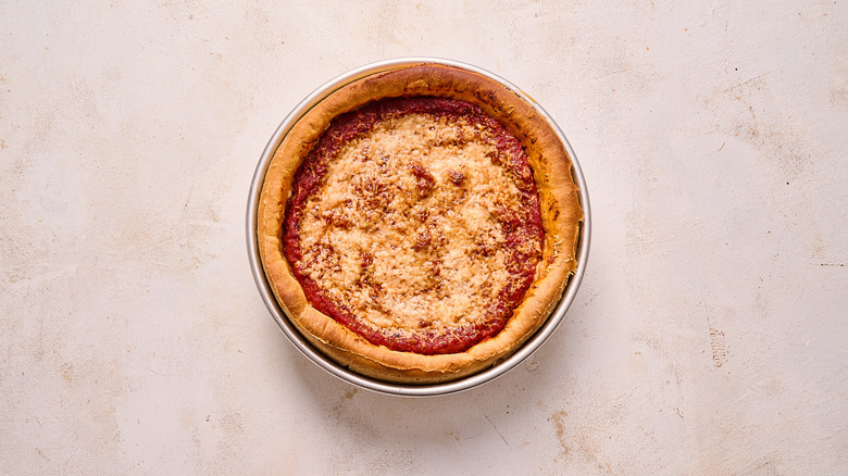 baked deep dish pizza on a table