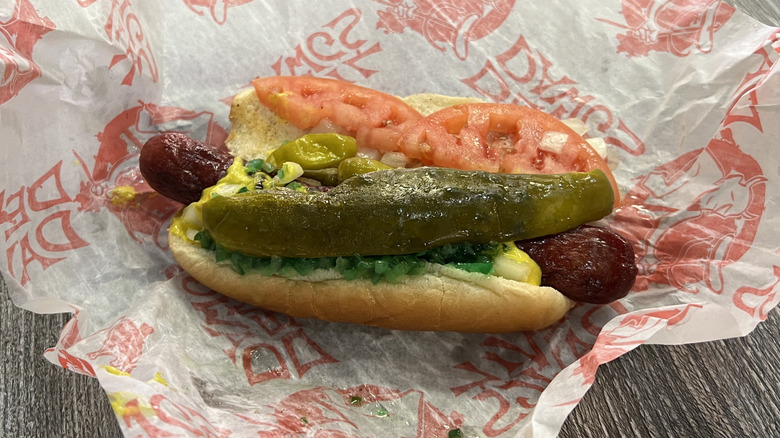 Chicago-style hot dog on paper wrapper