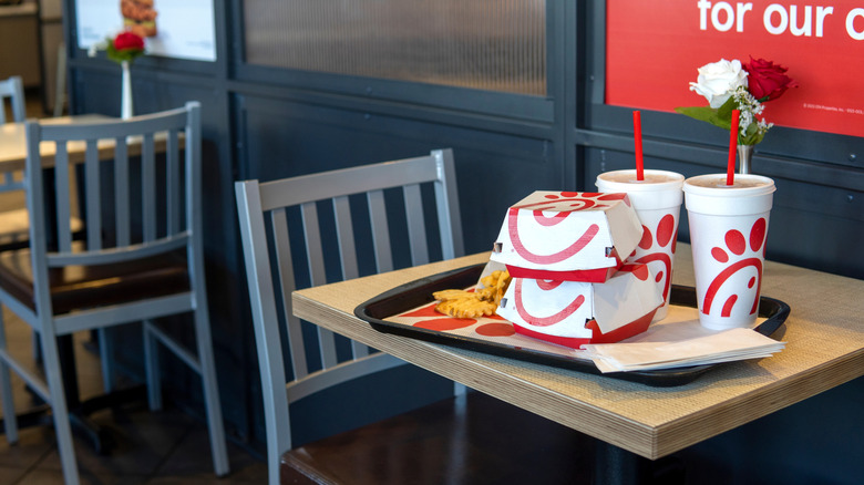 inside of a chick-fil-a restaurant with a meal on a table