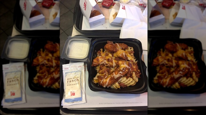 Chick-fil-A dishes mixed in large black salad bowl