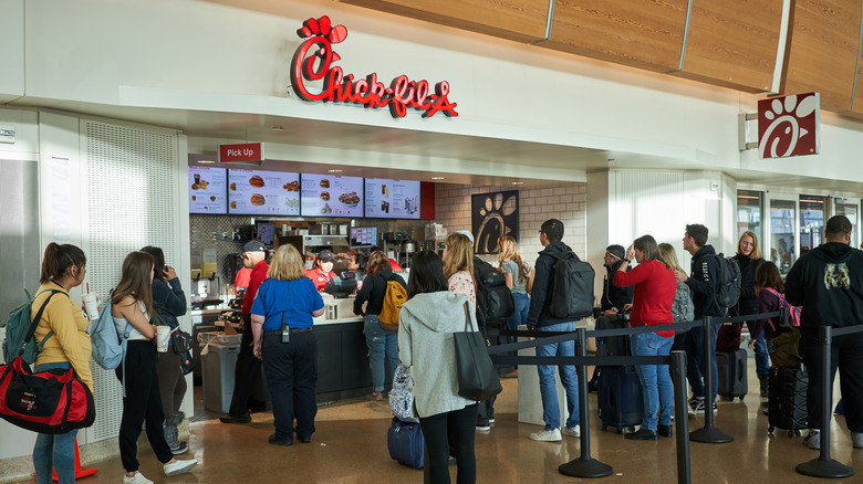 Long line at an airport Chick-fil-A location