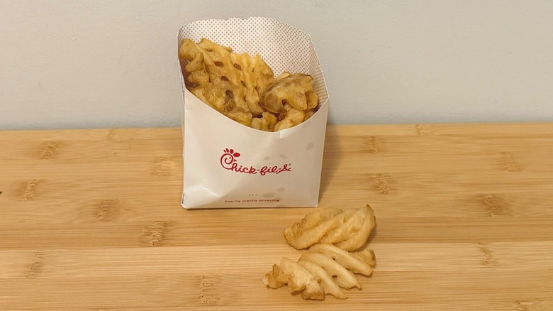 container of Chick-fil-A french fries on a table