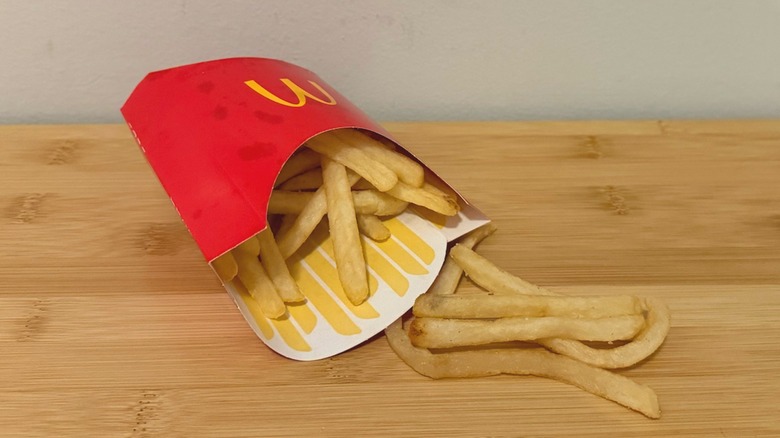 McDonald's french fries spilled out onto a table
