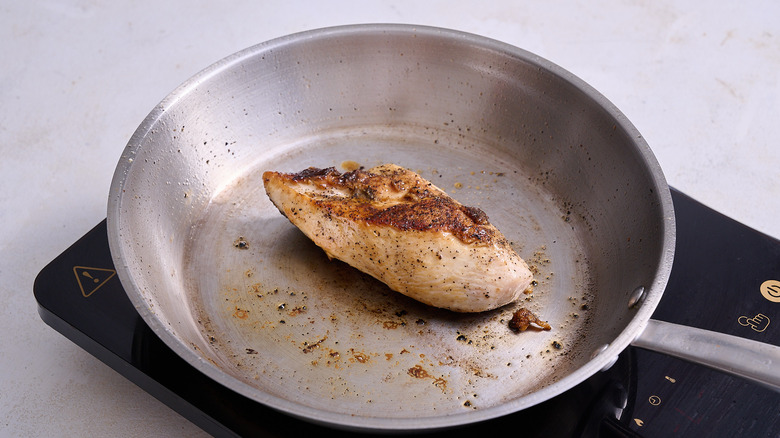 Seared chicken breast in skillet