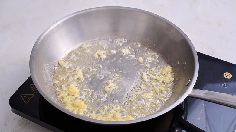 cooking garlic in a skillet