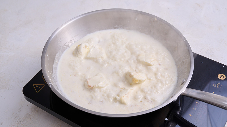 cooking cream in a skillet