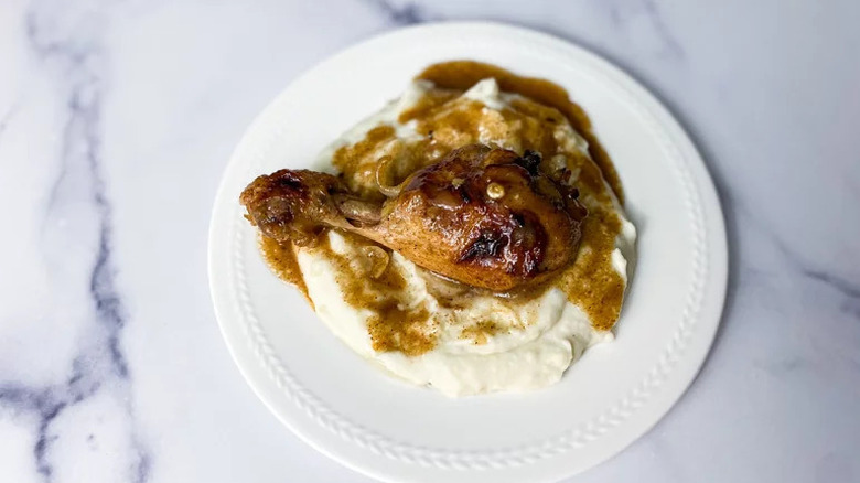 Baked Chicken with Cinnamon with mashed potatoes on white plate