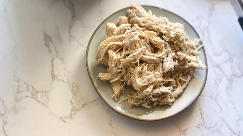 Instant Pot Chicken on white plate on counter