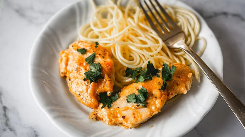 One-Skillet Creamy Chicken Lazone on white plate with spaghetti