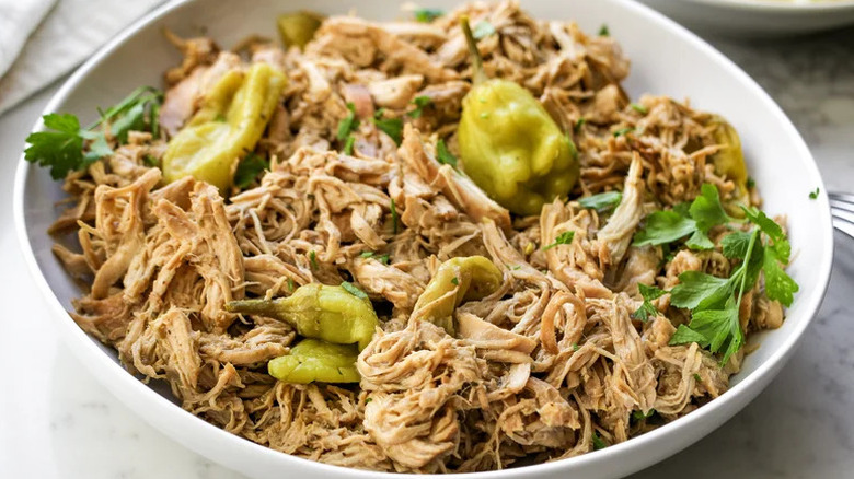Slow Cooker Mississippi Chicken in large white bowl