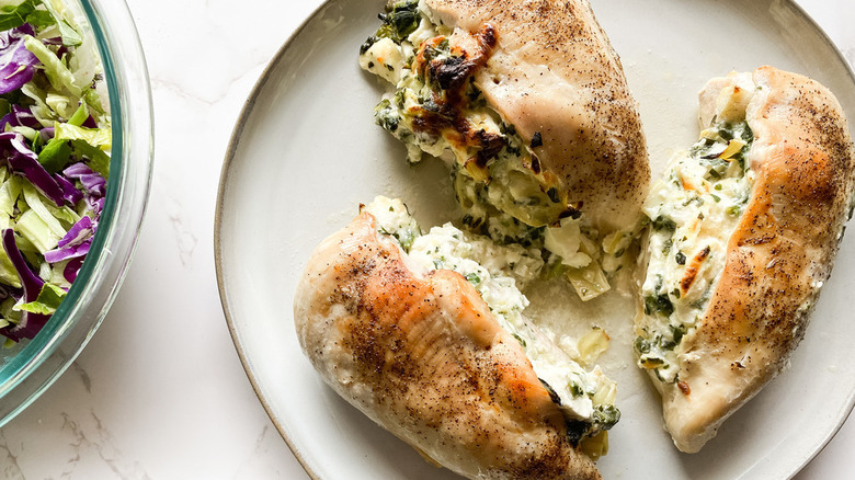 Stuffed Chicken Breasts on white plate