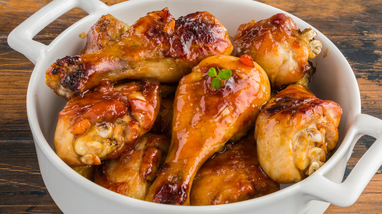 Baked glazed chicken drumsticks in teriyaki sauce