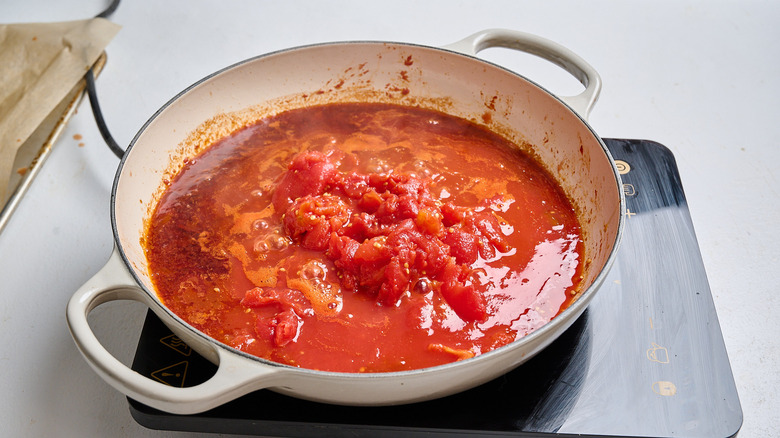 cooking tomato sauce in a skillet