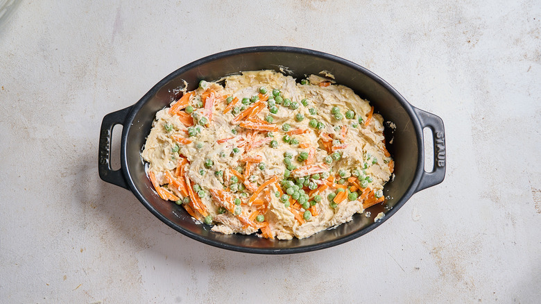 chicken filling and frozen vegetables in casserole dish