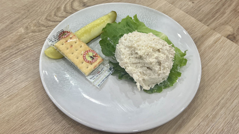 Chicken Salad Chick Dixie Chick scoop on a plate with crackers and a pickle