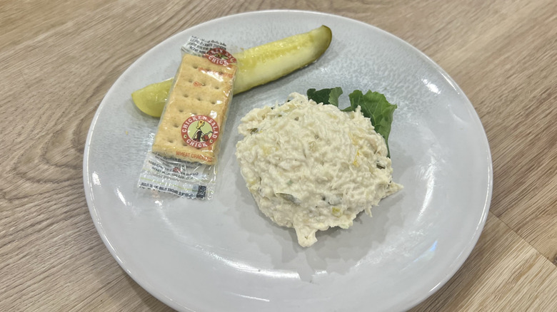 Chicken Salad Chick Olivia's Old South scoop on a plate with crackers and a pickle