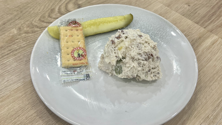 Chicken Salad Chick Fancy Nancy scoop on a plate with crackers and a pickle
