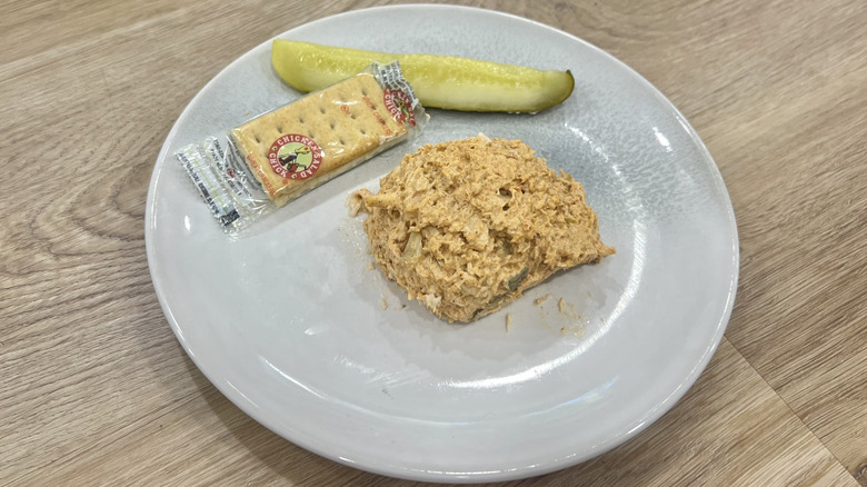 Chicken Salad Chick Nashville Hottie scoop on a plate with crackers and a pickle