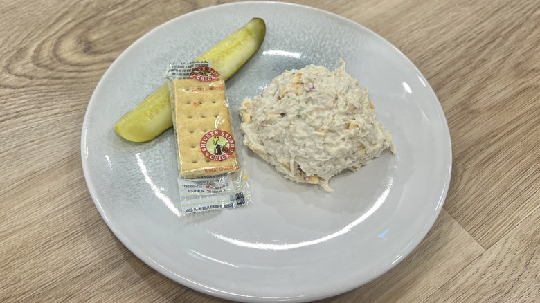 Chicken Salad Chick Sassy Scotty scoop on a plate with crackers and a pickle