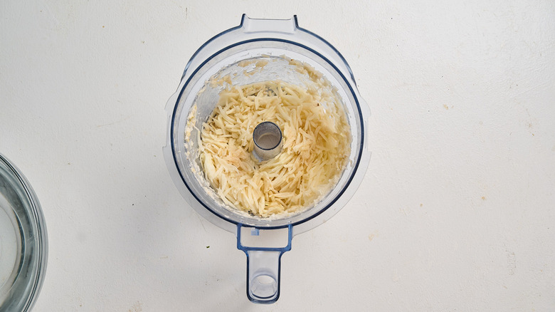 Shredding potatoes in a food processor