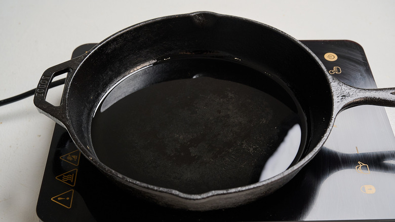 heating oil in a skillet