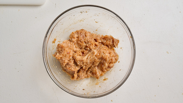 Chicken sausage ingredients in a bowl