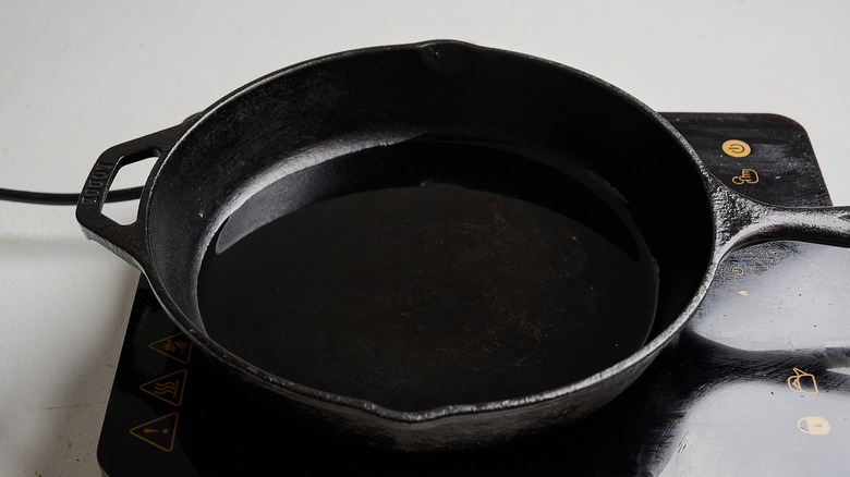 heating oil in a skillet