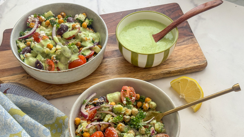 2 bowls of chickpea salad with dressing