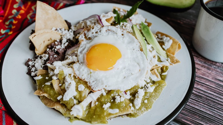 chilaquiles verdes topped with egg